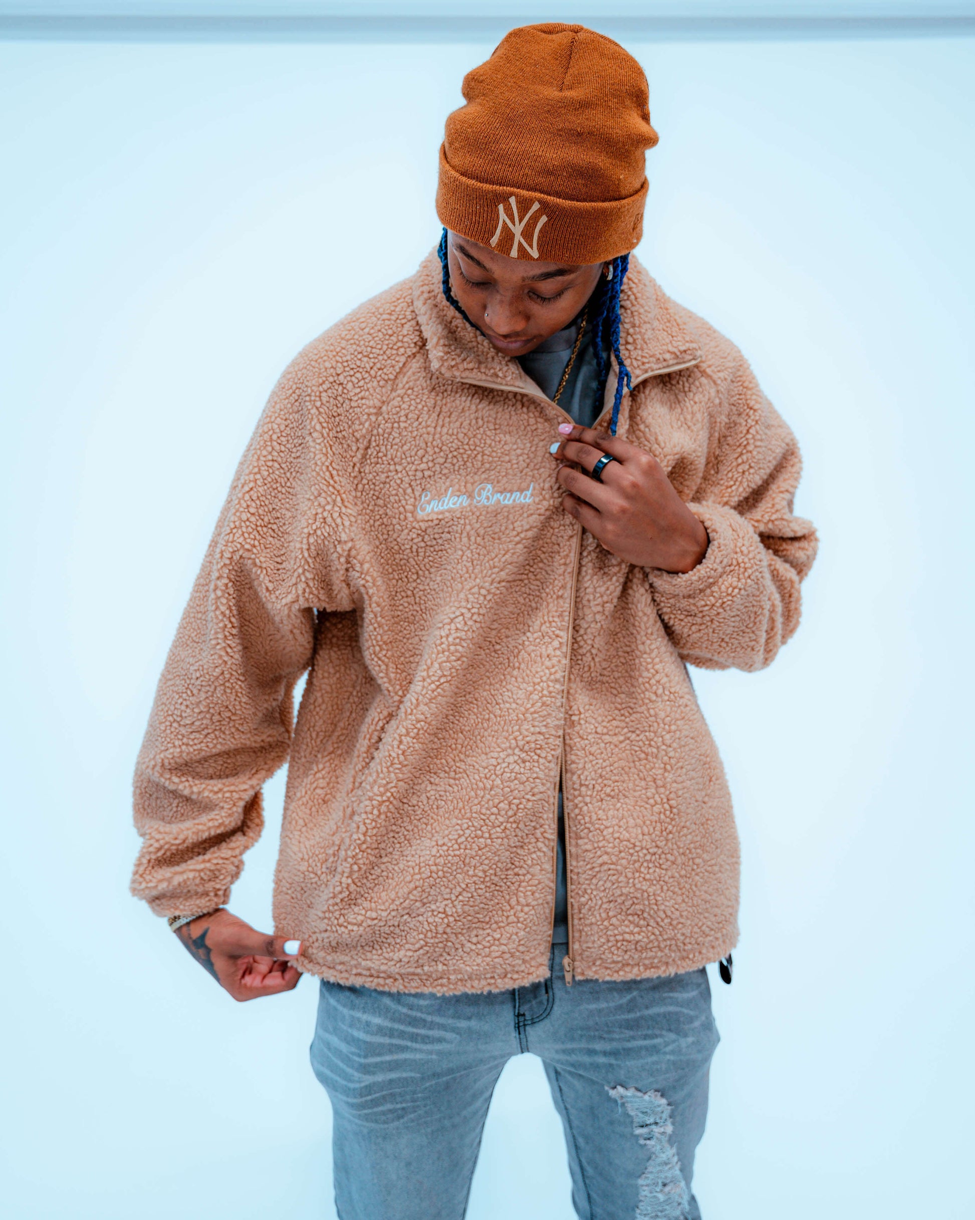 Model wearing ENDEN BRAND Sherpa fleece jacket styled for cozy look
