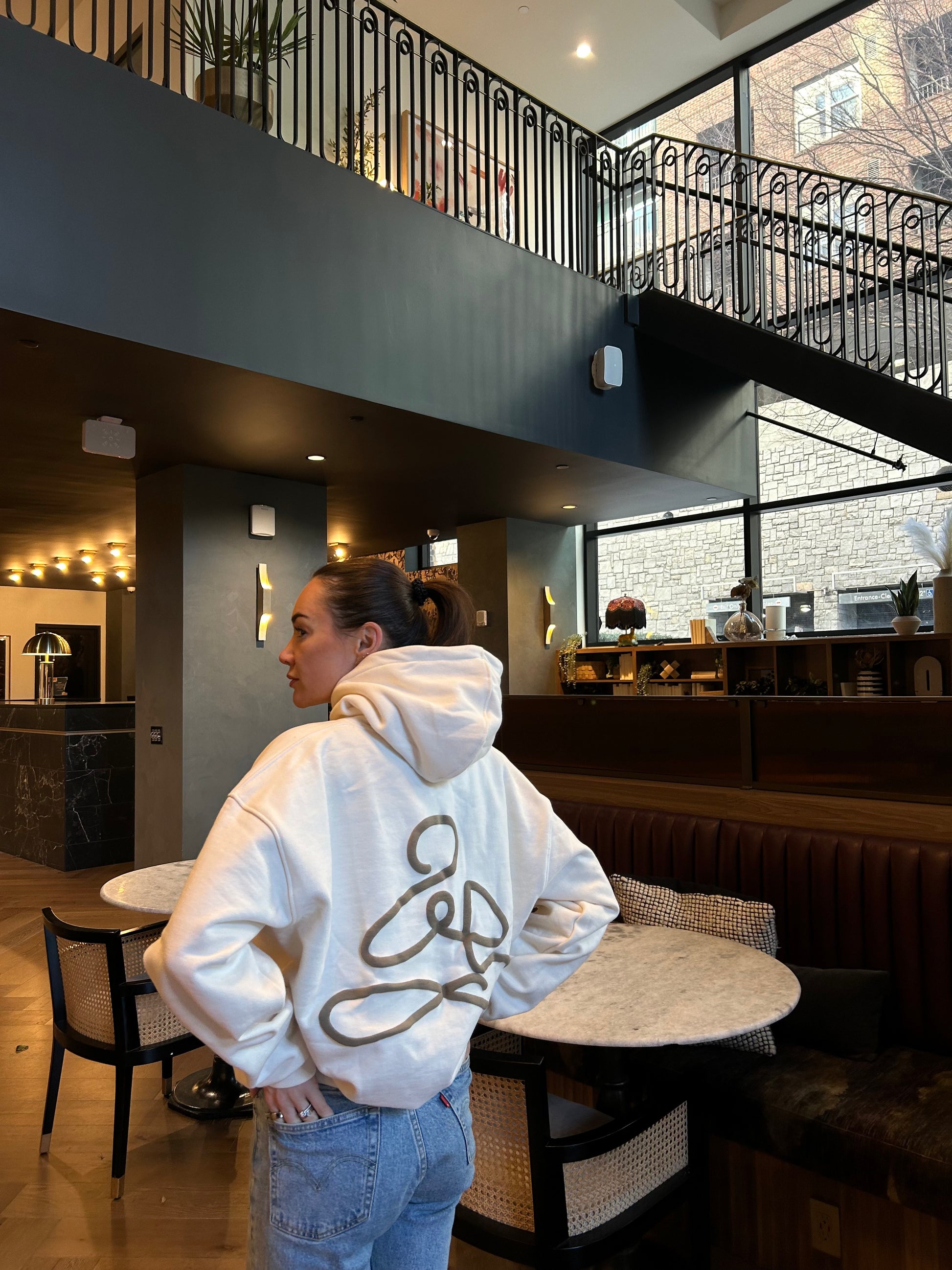 Back view of affirmation ENDEN BRAND hoodie in cream
