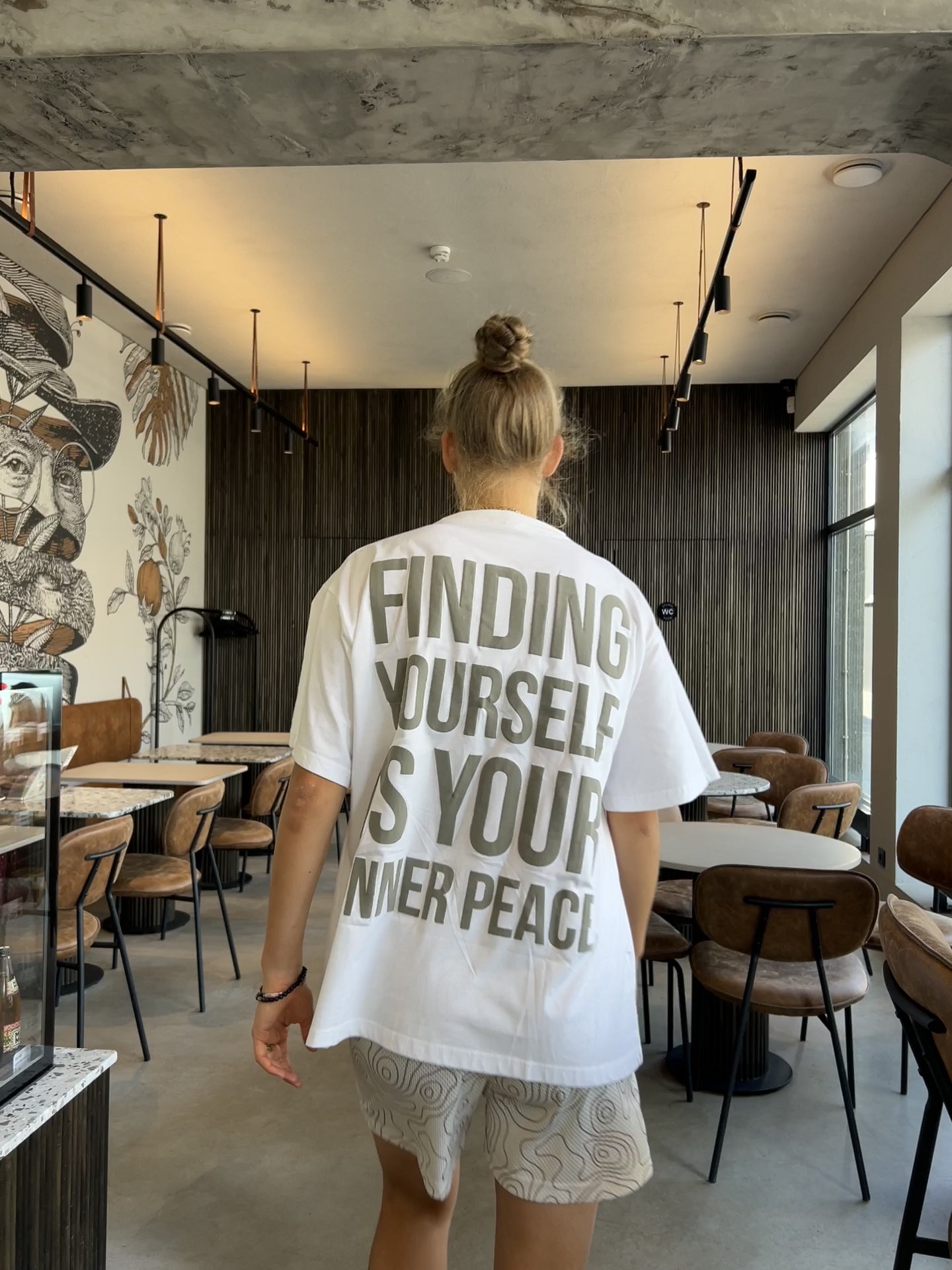 Video of model in white puff print t-shirt by ENDEN BRAND