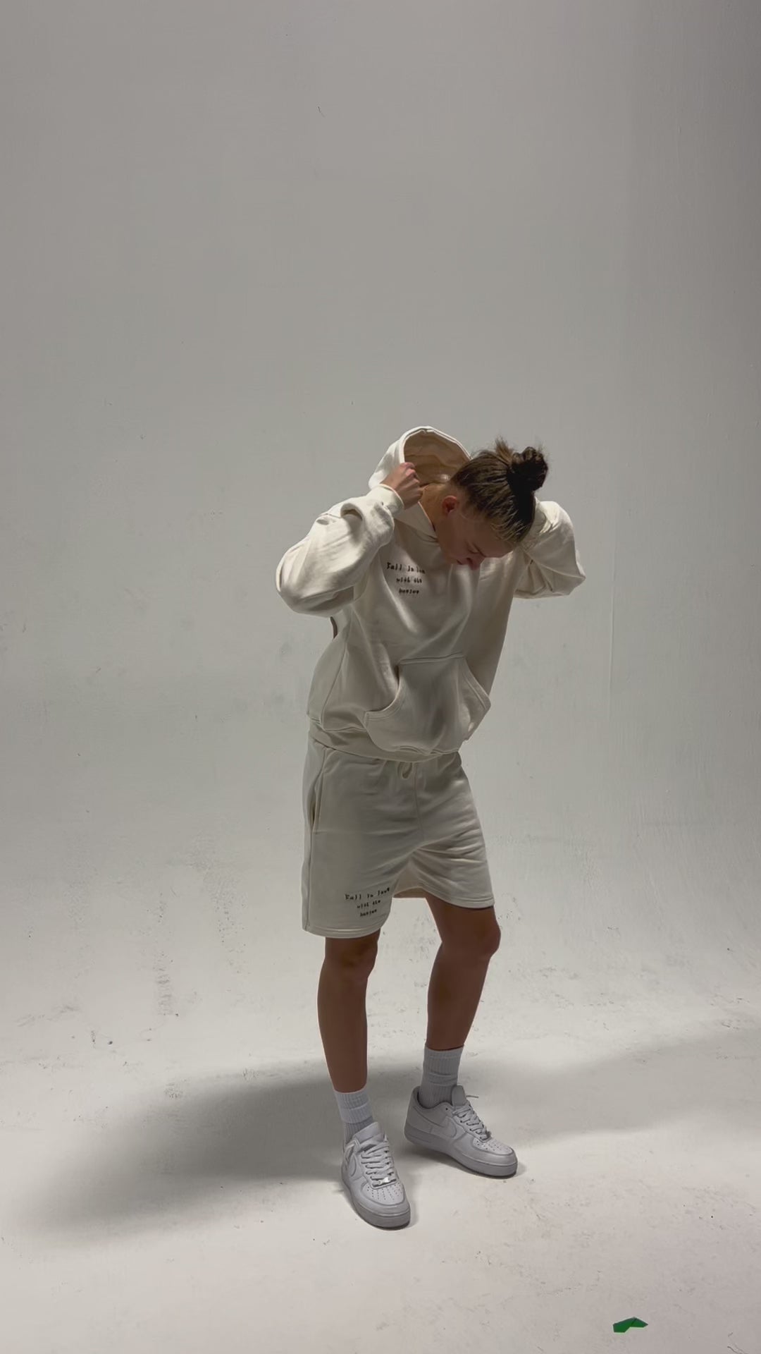 Video of model wearing ENDEN BRAND sweatshorts cream color with affirmations