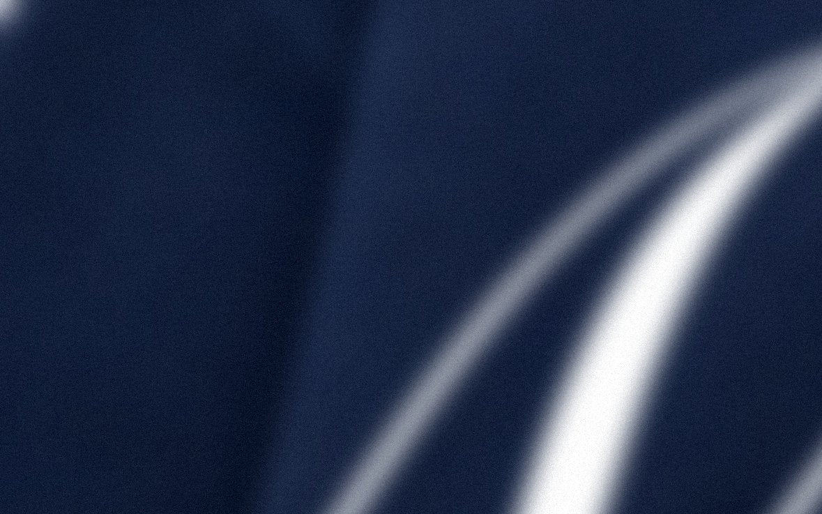 Close-up of a dark blue fabric with silver stripes